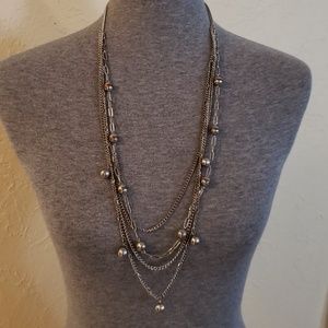Long silver colored necklace